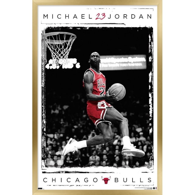 Michael Jordan - Dunk Wall Poster, 14.725" x 22.375" framed showing Michael Jordan in a red Chicago Bulls jersey number 23, mid-air dunking a basketball near the hoop with a black and white crowd background, featuring 'MICHAEL 23 JORDAN' text above and 'CHICAGO BULLS' with the Bulls logo below.