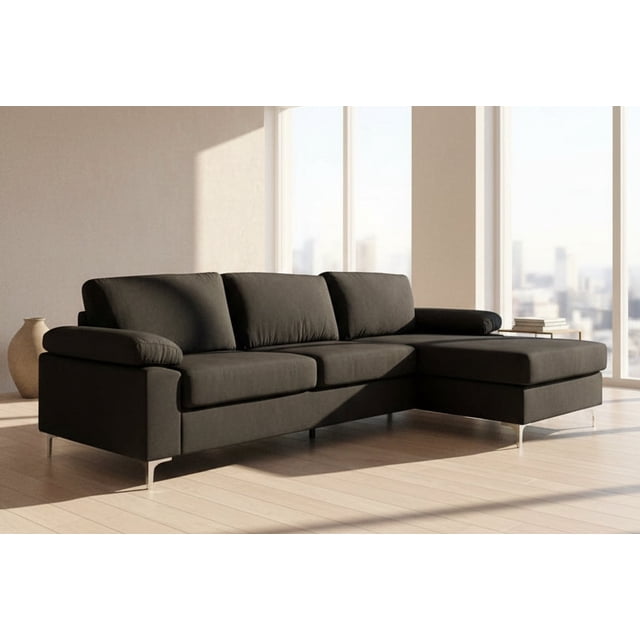 Zena - Modern Velvet Sectional With Chrome Legs in a sleek black velvet finish, featuring a low-profile design and removable back cushions. The sectional includes a right-facing chaise and chrome metal legs, offering a contemporary look. Dimensions are 103 inches by 52 inches, ideal for apartments or cozy living spaces. Shown in a bright, modern living room with large windows and natural light.