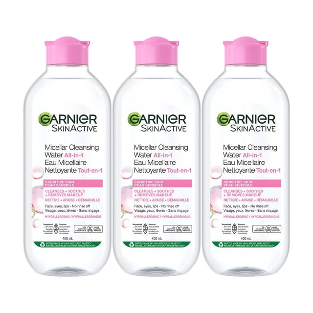 Garnier Micellar Cleansing Water all-in-1 face cleanser and makeup remover for all skin types including sensitive, shown as three 400 mL clear bottles with pink flip-top caps, designed to gently cleanse, hydrate, and remove makeup from face, eyes, and lips without rinsing, hypoallergenic, vegan, and free from alcohol, oil, fragrance, parabens, sulfates, and silicones.