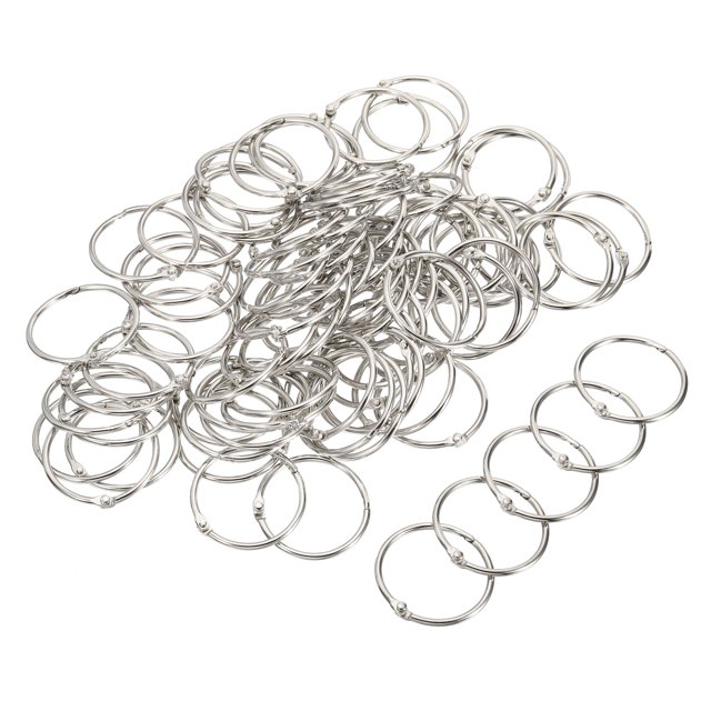 Unique Bargains 1.38' Dia. Detachable Binder Rings Index Snap Metal Clips, Silver Tone 100 Pack. A set of silver-tone metal binder rings with a 1.38-inch outer diameter, ideal for binding loose-leaf pages, menus, album pages, and scratch paper. These rustproof, lightweight rings feature a tight clasp for secure fastening and easy flipping, making them suitable for organizing office and school supplies or storing small items.