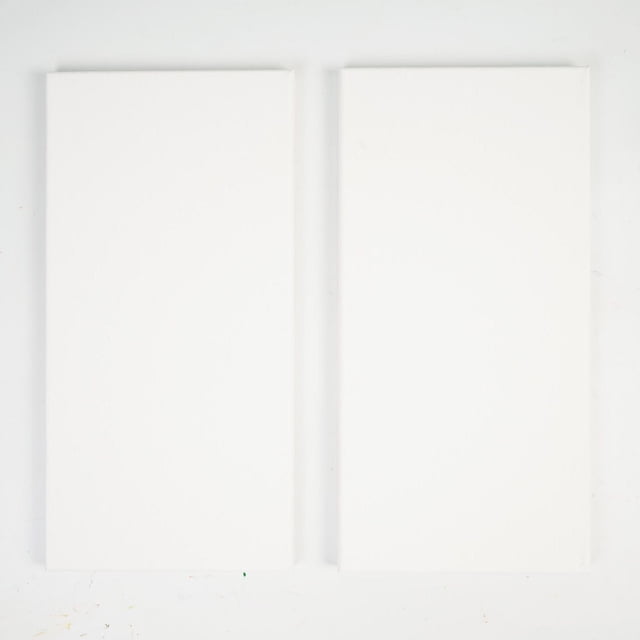 North Shore stretched canvas two-pack showing two blank white rectangular canvases made from 100% acid-free cotton, triple primed and stretched on smooth wooden frames, suitable for oil, acrylic, watercolor, and gouache painting, ideal for school or home art projects.