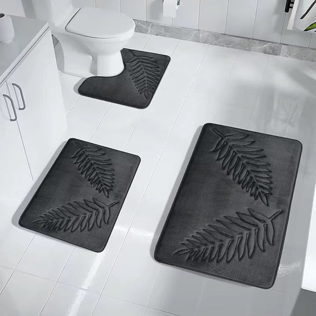 Meitianfacai 3 Pcs Bathroom Rugs, a soft memory foam bath mat set in dark gray with a leaf pattern. Includes three mats of varying sizes: 40x60cm, 40x50cm, and 50x80cm. Designed with a non-slip rubber backing for safety, these mats are water-absorbent and quick-drying, ideal for bathroom floors, toilet areas, and doorways. Made from polyester with a modern style, they are machine washable and environmentally friendly.