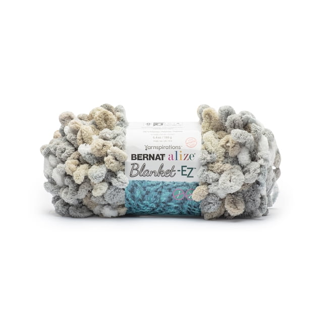 Bernat® Alize Blanket™ #7 Jumbo Polyester Yarn in Sandbox colour, a bulky looped polyester yarn in mixed grey, beige, and cream tones, designed for easy finger knitting without needles, shown with branded label.