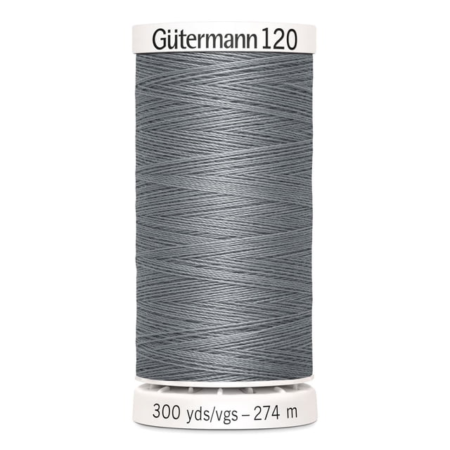 Gutermann 120 100% polyester all purpose thread spool in grey, tightly wound on a white plastic spool labeled 'Gütermann 120' on top and '300 yds/vgs – 274 m' on the base, suitable for machine and hand sewing cotton, synthetics, wool, and craft projects like home décor and beading.