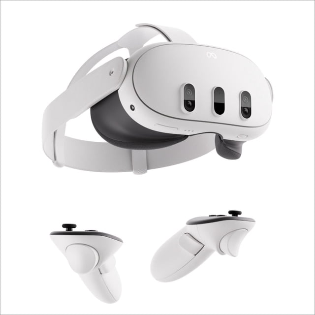 Meta Quest 3 512GB all-in-one virtual reality headset with white front panel featuring dual RGB color cameras and central sensor, adjustable white fabric head strap, and black cushioned face padding, shown with two white ergonomic wireless controllers with black buttons and thumbsticks on a white background, suitable for immersive gaming and mixed reality experiences.