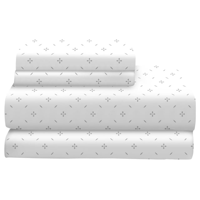 Johnson Home 200 TC Bed Sheet Set - Printed Cotton Sheets with a white base and subtle grey floral pattern, folded to show flat sheet, fitted sheet, and pillowcases, made from breathable 200 thread count cotton for year-round comfort and moisture-wicking sleep.
