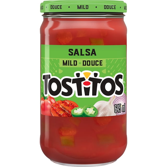 Tostitos Mild Salsa in a 645 mL clear glass jar with a green lid labeled 'Mild Douce'. The label features images of tomato, grilled tomato slice, jalapeño peppers, garlic bulb, and red onion, with visible vegetable chunks in the red salsa. Often used as a dip with tortilla chips or added to snacks for mild zesty flavour.
