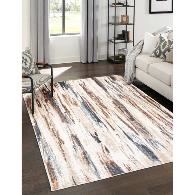 ECARPET Atelier Contemporary/Modern Area Rug with abstract beige, brown, and blue pattern on dark hardwood floor in a living room featuring a beige sofa with patterned pillows, a black metal chair with geometric cushion, and a black metal shelving unit near a window with grey curtains. Suitable for living rooms, bedrooms, or hallways.
