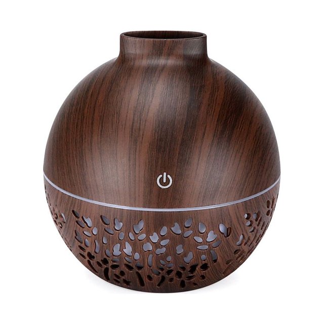 Essential Oil Diffusers Aqestyerly Air Aroma Essential Oil Diffuser with LED light and aromatherapy humidifier. The diffuser features a spherical design with a dark wood grain finish and decorative cutouts near the base. It includes a USB power connection, a 130ml water tank, and a 7-color night light for a relaxing ambiance. Suitable for humidifying air, aromatherapy, and skin care. Approximate dimensions are 103x103x109mm.