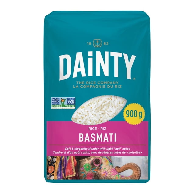Dainty Basmati Rice front-centered close-up of loose long-grain white rice showing slender translucent kernels; exceptionally fragrant Punjab-origin basmati irrigated by Himalayan waters, glossy grains with a slightly nutty flavour and often used as a base for pilaf or biryani.