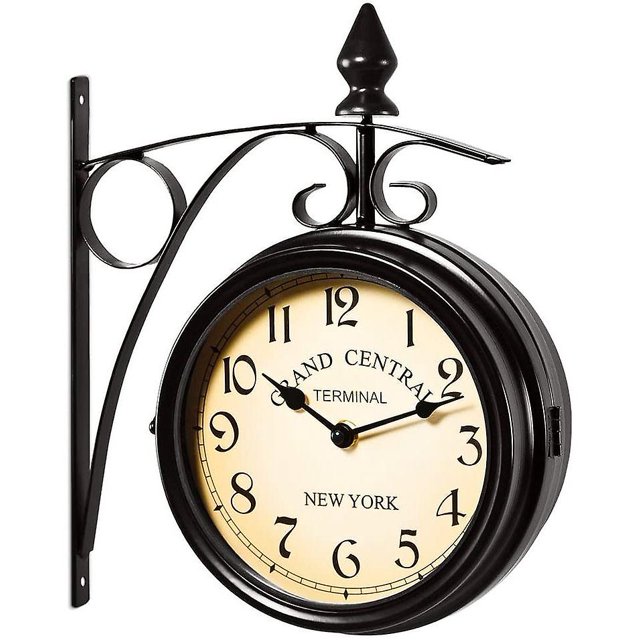 Two Sided Train Station Wall Clock Black Vintage Design Clock Watch with a double-sided display featuring Arabic numerals on both dials. Mounted on a wrought iron bracket, this wall-mounted clock evokes a Grand Central Terminal theme. Made of durable metal and glass, it allows for two different time settings, ideal for home décor.