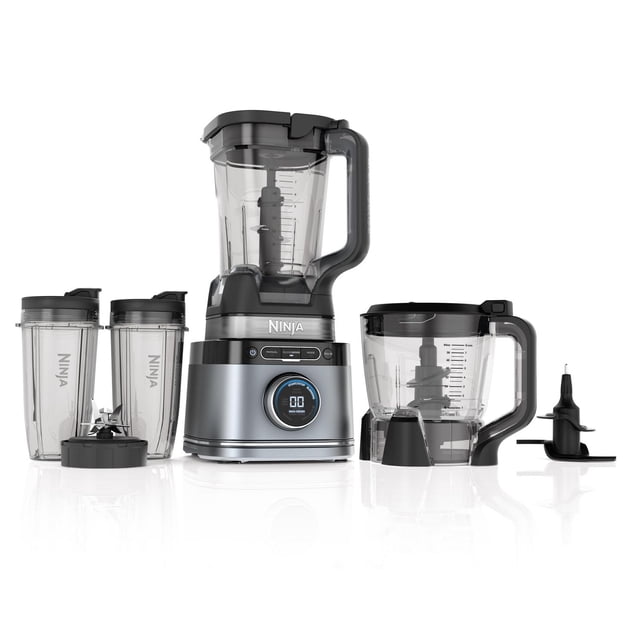 Ninja Detect Kitchen System Power Blender + Processor with Blend Sense Technology in silver, featuring a 1701 peak watt motor base, 72-oz full-size pitcher, 48-oz food processor bowl, two 24-oz single-serve cups with lids, and multiple blade assemblies for blending, chopping, and crushing with automatic speed and time adjustment.