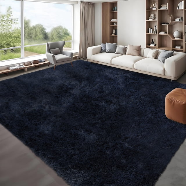 HOMERRY Fluffy Area Rug 8' x 10' in navy blue displayed in a modern living room setting. This plush shaggy accent rug features a 1.57-inch high-density faux fur pile for ultra-soft comfort. The area rug includes an anti-slip bottom with grip dots for stability, making it ideal for bedrooms, living rooms, or playrooms. The spacious design enhances the decor with its rich color and luxurious texture.