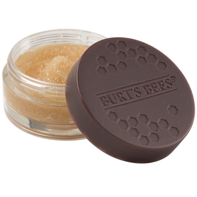 Burt’s Bees 100% Natural Conditioning Lip Scrub with Exfoliating Honey Crystals in a clear round jar showing light brown exfoliating scrub, with a dark brown embossed lid featuring honeycomb patterns and Burt’s Bees logo, designed to gently exfoliate and condition lips for smooth lip balm or treatment application, also suitable for an at-home spa lip care routine.