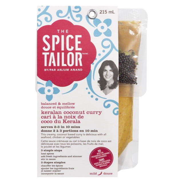 The Spice Tailor Keralan Coconut Curry Pochette de 215 ml Contenant une sauce Crémeuse à Base de Noix de Coco avec des Feuilles de Curry et des Graines de Moutarde, Servant 2-3 portions en 10 minutes, avec des instructions de Cuisson Bilingues sur une Étiquette Blanche avec des Motifs Floraux Bleus.
