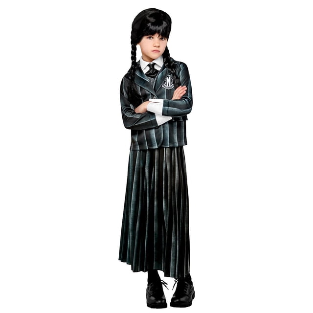 Child's Wednesday Addams Costume featuring a black sleeveless top with attached tie, black jacket with Nevermore Academy emblem, and a long pleated black skirt, paired with black lace-up shoes, suitable for girls' Halloween costumes and dress-up events.
