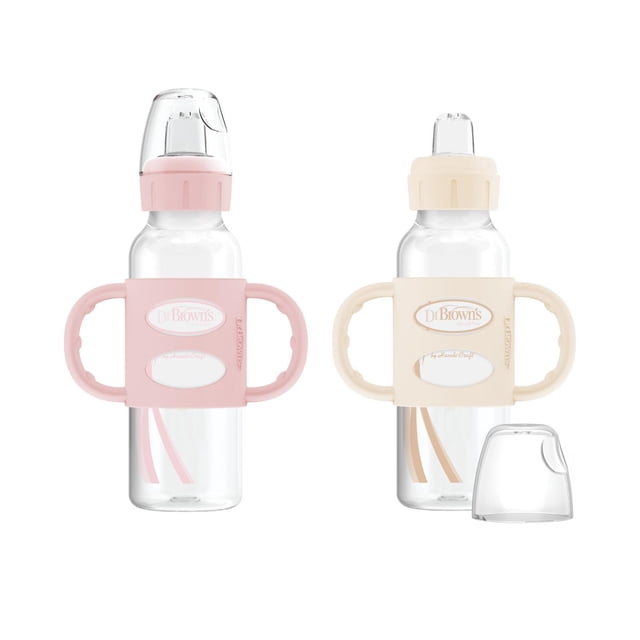 Dr. Brown's Milestones Narrow Sippy Bottle with Silicone Handles Pink 2 Pack with two clear 8 oz narrow baby bottles, each featuring removable soft silicone sippy spouts, flexible pink and beige handles for easy grip, and snap-on caps to keep spouts clean for baby feeding transition.