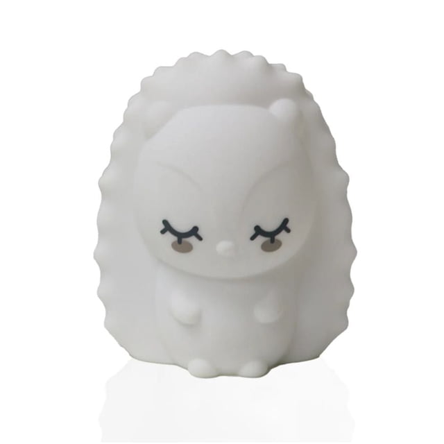 bblüv - Hög - Silicone Portable Night Light shaped like a white hedgehog with closed eyes and textured silicone body, compact and shock-resistant, designed for indoor lighting accessories, shown front-facing on a white background.