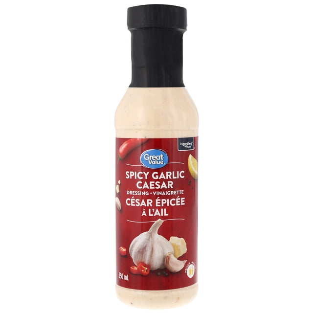 Great Value Spicy Garlic Caesar Dressing in a 350 ml clear plastic bottle with black cap and red label featuring garlic, chili peppers, lemon, and cheese, labeled in English and French. This medium heat salad dressing is suitable for salads, dips, and marinades.