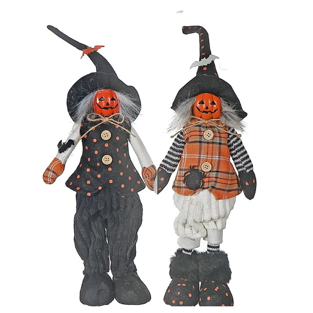 Cotton Standing Witch Halloween décor featuring two standing witches with pumpkin faces dressed in black and orange cotton outfits with polka dots and plaid patterns, tall pointed hats, and fuzzy boots, ideal for outdoor Halloween decoration.