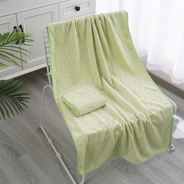 Extra Large Bath Towel Set Of 2 Oversized Bath Sheet Super Soft Absorbent Bathroom Towel Set Microfiber Dry Shower Towel For Hotel Bath Gym, Czzoypi Extra Large Bath Towel Set. The image displays two green oversized bath sheets with a wavy textured pattern, one folded and one draped over a white metal chair in a bright bathroom. Crafted from polyester microfiber, these towels are highly absorbent, durable, and suitable for bathrooms, gyms, hotels, spas, and swimming pools.