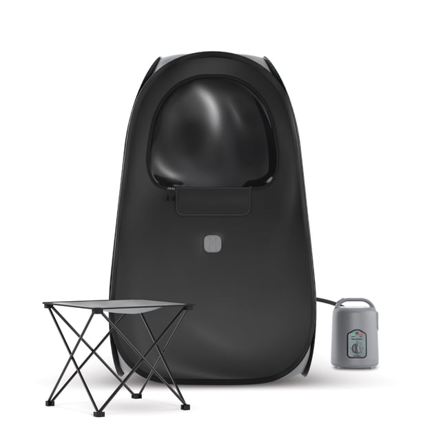 Homedics Portable Pop-Up Steam Sauna with a collapsible black sauna tent, foldable chair, and compact steamer tank. This portable sauna heats up to 113°F with 100% humidity, providing up to 60 minutes of runtime for a spa-like experience at home. The ultra-compact design folds into a storage bag for easy portability and accommodates users up to 198.12 cm (6 ft 5 in.) while seated.