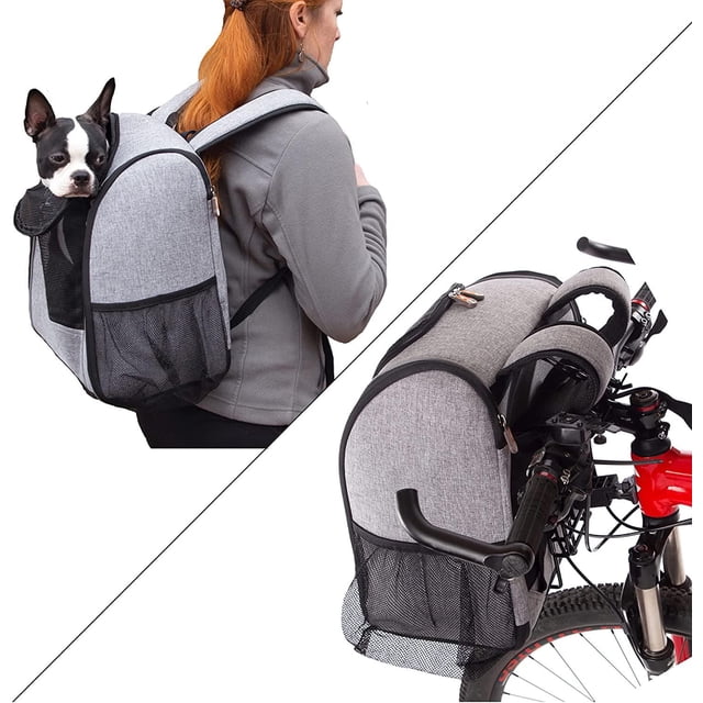 K&H Pet Products Travel Bike Backpack For Pets in grey fabric with mesh side pockets and a front mesh window, shown worn on a person's back carrying a small black and white dog, and mounted on the handlebars of a red bicycle for secure pet transport.