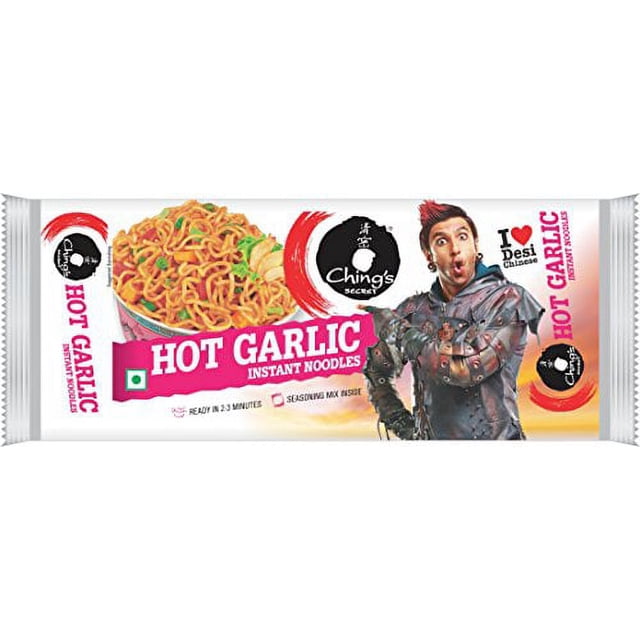 Ching's Secret Hot Garlic Instant Noodles package displaying a bowl of spicy South Asian street-style noodles with garlic and herbs, the brand logo, and text highlighting quick 2-3 minute preparation, ideal for a fast, flavorful meal.