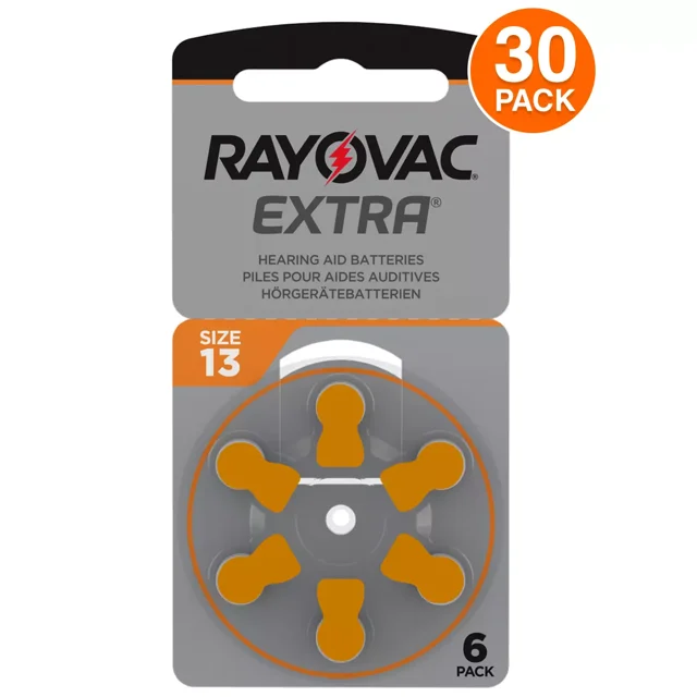 Rayovac Extra Size 13 Hearing Aid Batteries, 30 Pack. The packaging features a secure dial with six orange-tabbed batteries visible in a circular arrangement. Designed for high-use hearing devices, these batteries hold power for up to 4 years in storage and are made in the USA with global parts. The package includes an easy-to-use reclosable door and won the 2018 Ameristar award for innovative design.