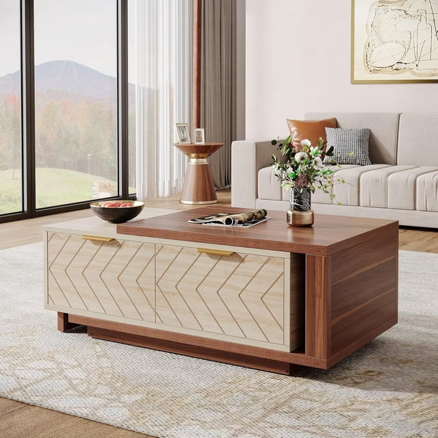 Tribesigns Extendable Coffee Table with 2 Storage Drawers, featuring a dual-tone walnut and oak veneer design. The table includes a sliding tabletop, V-shaped drawer patterns, and brass hardware for a luxurious touch. It offers hidden storage and two spacious drawers for organization. Shown in a modern living room setting with a beige sofa, decorative accents, and a large window view.