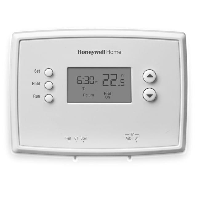 Honeywell Home Thermostat Programmable sur une Semaine avec un Corps Rectangulaire Blanc, Affichage Numérique Affichant 6:30 pm et 22,5 °C, Ensemble à Trois Boutons Étiquetés, Maintien, Marche à Gauche et Flèches Haut/bas à Droite pour le Réglage de la Température, Indicateurs de mode Supplémentaires pour la Chaleur, Arrêt, Refroidissement et Allumage/auto du Ventilateur sous l'Écran pour un Contrôle Précis du Chauffage et du Refroidissement à la Maison.
