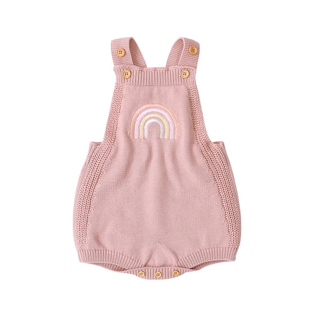 Baby Girls Sleeveless Jumpsuit, Knitted Romper Embroidered Rainbow Pattern Bodysuit in a soft pink colour. Features a ribbed knit texture, criss-cross back straps with wooden button closures, and a snap closure at the bottom for easy dressing. The front showcases an embroidered rainbow design. Suitable for infants aged 3-24 months, made of high-quality cotton for comfort and breathability. Ideal for casual wear, baby photos, or special occasions.