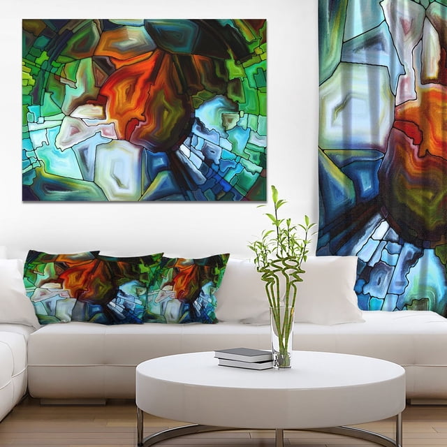 Design Art Abstrait Vitrail Design Impression sur Toile Galerie Enveloppée d'Un sous-Cadre en Bois de 1 Po, Présentant des Formes Géométriques Abstraites Vibrantes dans des Tons Vert, Bleu, orange et Brun. Affichée au-Dessus d'Un sofa Sectionnel Blanc avec des Coussins Assortis dans un Salon Moderne avec une table Basse Blanche Ronde et un vase en Verre Tenant des Tiges de Bambou. Cette Impression sur Toile en Coton Prête à Accrocher Est Idéale pour Rehausser la Déco de la Maison Ou du Bureau.