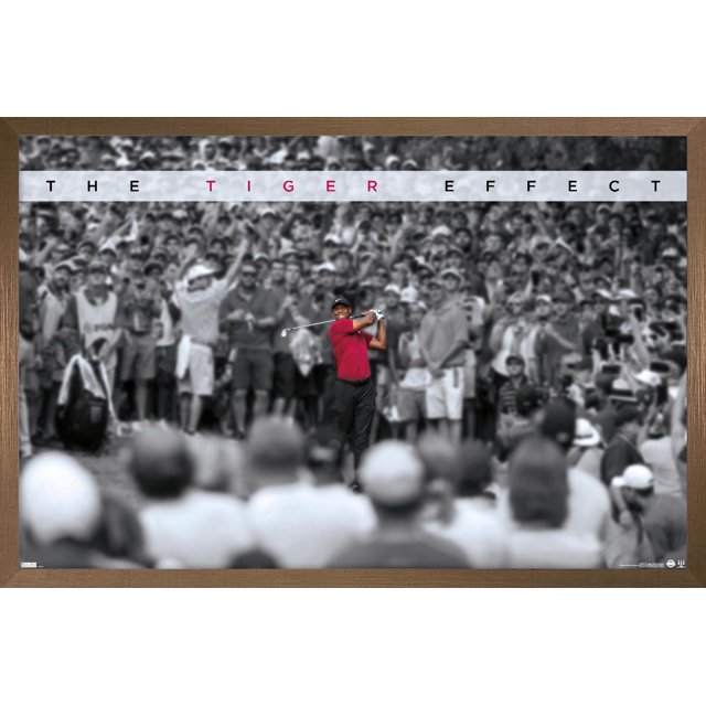 Tiger Woods - The Tiger Effect Wall Poster, 22.375" x 34", depicting Tiger Woods in a red shirt and black pants mid-swing with a golf club against a black-and-white crowd background with THE TIGER EFFECT text above, printed on glossy poster paper suitable for home or office wall decor.
