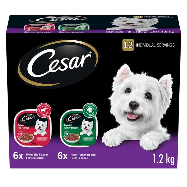 Cesar Adult Filets In Sauce 12-pack box with 6 trays of Roasted Turkey Flavour and 6 trays of Prime Rib Flavour soft wet dog food, each 100g, for small breed adult dogs, featuring black and purple packaging and the Cesar logo.