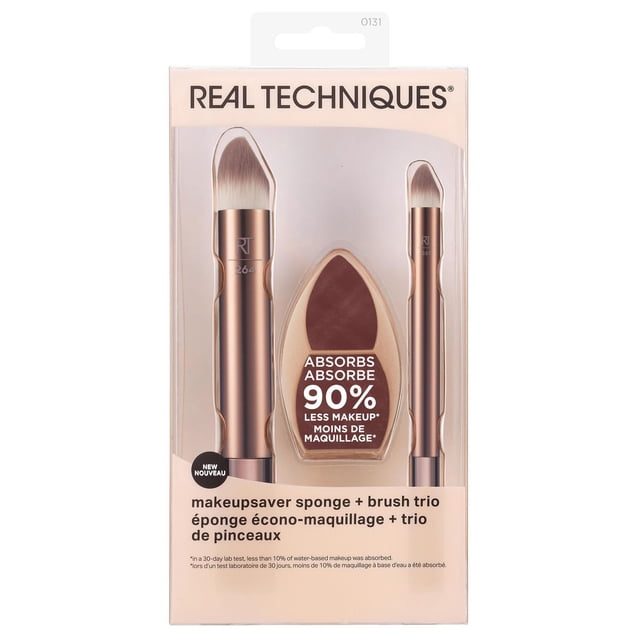 Real Techniques Makeupsaver Sponge + Brush Trio with two rose gold synthetic brushes featuring sloped heads and a beige fingerprint-textured makeup sponge that absorbs 90% less water-based makeup, shown in clear packaging with bilingual labeling.