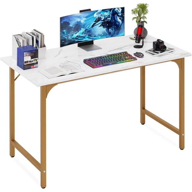 BestOffice Computer Desk, Home Writing Study Table Modern Simple Style PC, Metal Frame for Home Office, Gold. A modern desk with a white marble-like tabletop and gold metal frame, offering a minimalist design. The spacious surface accommodates a monitor, keyboard, books, and decor, ideal for writing, studying, or gaming. Features adjustable leg pads and steel brackets for stability, suitable for home or office use.