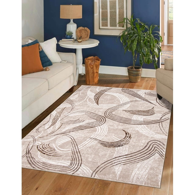 ECARPET Wisp Contemporary/Modern Area Rug featuring beige background with abstract brown and white curved line patterns, placed on hardwood floor in a living room with beige sofas, a white round side table with a lamp and decor, and a green potted plant near a navy blue wall. Suitable for living rooms, bedrooms, or hallways.