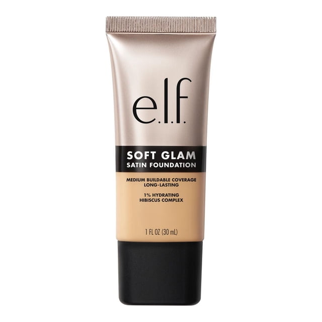 e.l.f. Cosmetics Soft Glam Satin Foundation in a 30 ml beige tube with matte black cap, providing medium buildable coverage and a satin finish. Infused with 1% Hydrating Hibiscus Complex, this long-lasting liquid foundation suits dry, oily, and combination skin without caking.
