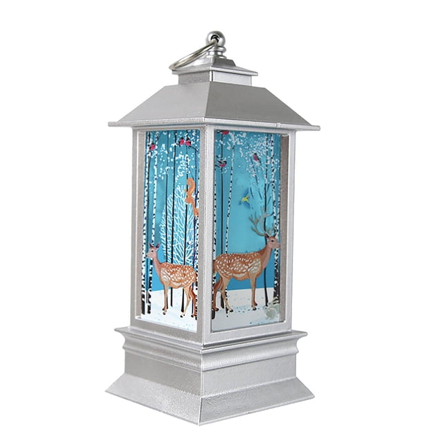 RKSTN Night Light, LED Lights Christmas Lantern Candlestick Lamp featuring a silver frame with a winter-themed design of deer and trees on a blue background. This PVC night light measures 13x5.5cm (5.1x2.2in) and is suitable for Christmas tree hanging, table decor, or home decorations. The warm LED light creates a cozy ambiance, making it ideal for bedrooms, living rooms, or as a festive ornament. Includes a top loop for easy hanging.