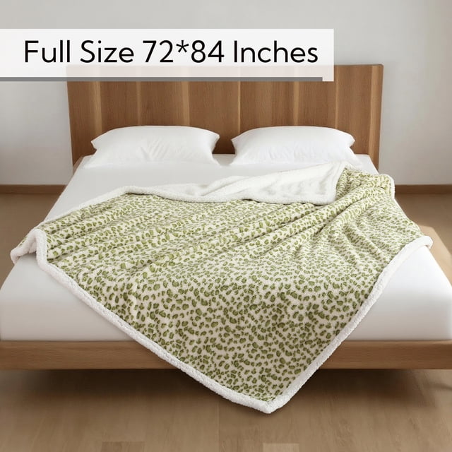 SUNNY HEAT Heated Electric Blanket Full Size 72'' x 84'' in leopard green and white pattern, displayed on a neatly made bed with a wooden headboard. The blanket features 6 heating levels, 1-10 hour auto-off settings, and is machine washable for convenience. Ideal for home, travel, or workspace use, it offers rapid warmth and advanced safety features like ETL certification and overheat protection.