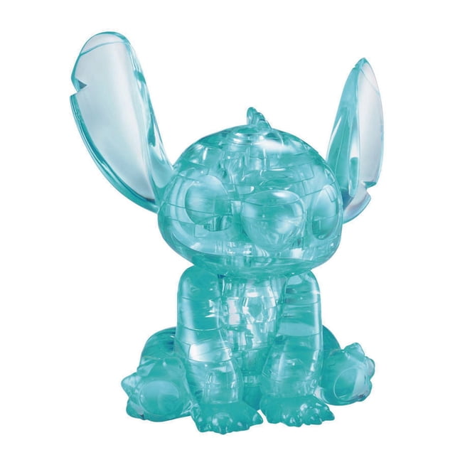 Disney Stitch 3D Crystal Puzzle featuring a translucent blue crystalline figure of Stitch sitting with large upright ears, made of interlocking puzzle pieces with a glossy finish, suitable as a decorative collectible and 3D puzzle for ages 12 and up.