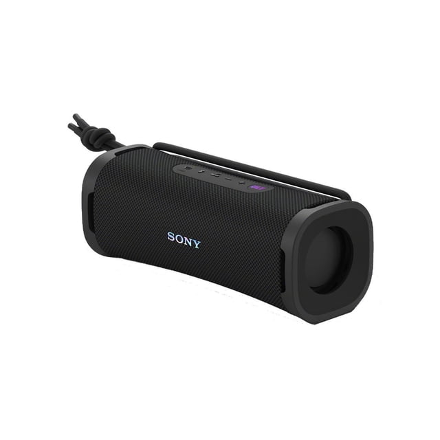 Sony ULT Field 1 Wireless Portable Speaker in black with a compact cylindrical design, textured mesh body, top control buttons including a purple ULT bass boost, and a detachable multi-way strap tied at one end, featuring waterproof, dustproof, rustproof, and shockproof durability ideal for outdoor use.