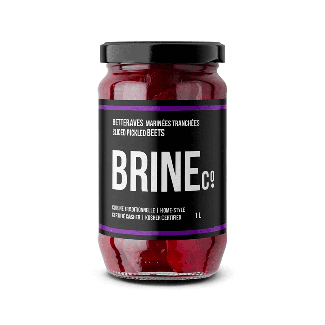Brine Sliced Pickled Beets 1L Jar pickled beet slices visible through a clear 1L glass jar in light brine, Brine&Co label on the side; vegan, gluten-free and kosher certified per product details; suitable as a salad topping or charcuterie accent.