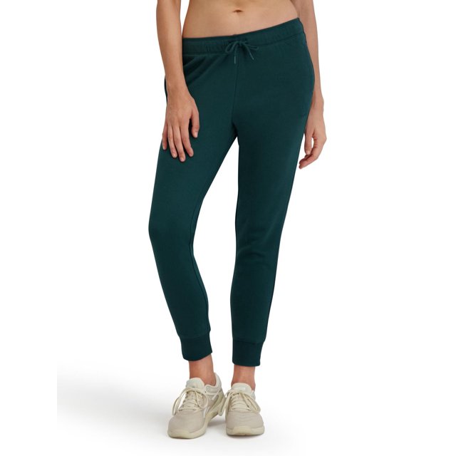 Reebok Jogger en Molleton pour Femmes, Vert Foncé, avec Taille Élastique Mi-Haute, Cordon de Serrage Ajustable, Poches Latérales, Poignets Côtelés et Jambes Fuselées Pleine Longueur, Montré sur un Modèle de la Taille Mi-Haute aux Chevilles, Espadrilles Beiges, Idéal pour une Tenue Décontractée Ou des Activités Légères.