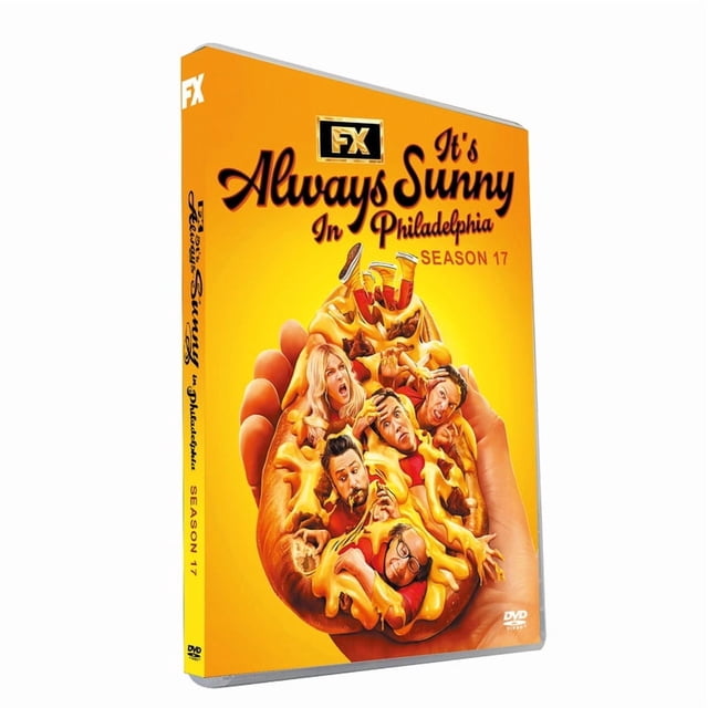The DVD cover of 'It's Always Sunny in Philadelphia Season 17,' featuring a vibrant yellow background with a comedic illustration of characters embedded in a cheesy pizza slice. The FX logo is prominently displayed at the top, with the title in bold, stylized text. The DVD case is shown at a slight angle.