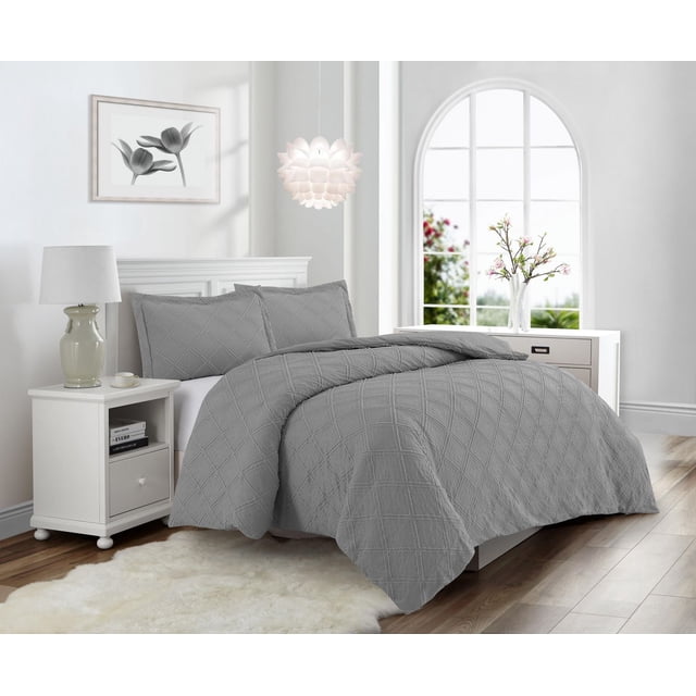 Swift Home Waffle Square Prewashed Duvet Cover Set in grey with matching pillow shams, featuring a textured waffle square pattern in 100% polyester fabric with zipper closure. Machine washable and easy care, displayed on a bed in a bright bedroom with white furniture and floral accents.