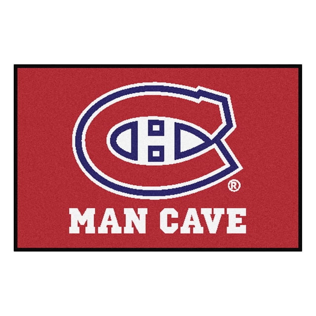 NHL Montreal Canadiens Man Cave Rug, a 19 by 30 inch red rectangular mat featuring the blue and white Montreal Canadiens logo above bold white 'MAN CAVE' text, made with 100% nylon face and non-skid recycled vinyl backing, ideal for decorating a fan cave or office.
