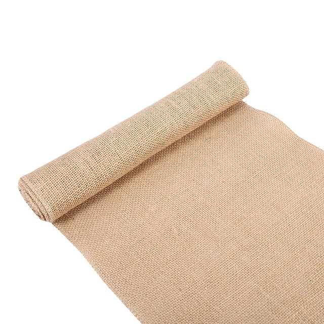 Natural Jute Ribbon Burlap Ribbon for Crafts, Wedding Decoration, Packaging (30cm * 2m). A roll of flaxen-colored burlap ribbon made from high-quality hessian fabric, featuring a rustic texture and neatly sewn edges to prevent fraying. Ideal for wedding decorations, festival feasts, party decor, and various craft projects. The ribbon is rolled and displayed on a plain white background.
