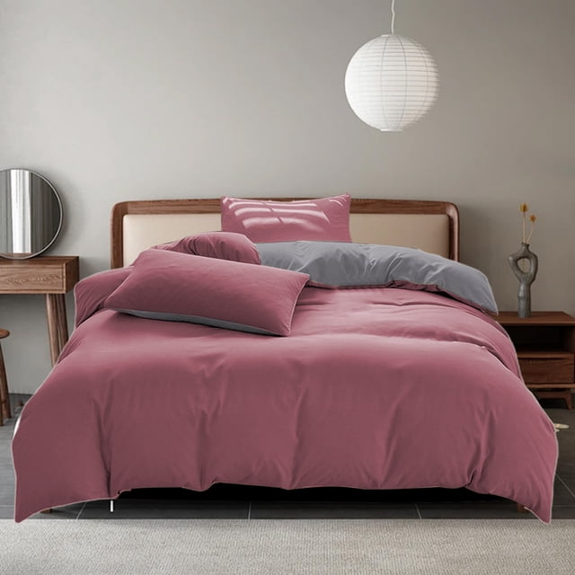 Bedding Duvet Cover Sets, 4-piece set in a solid red color, displayed on a queen-size bed in a modern bedroom. The set includes a duvet cover, bed sheet, and two pillowcases made from a soft, breathable, and durable linen-feel fabric. The bedding is styled with a smooth texture and is suitable for all seasons. The bed is framed by a wooden headboard, with a minimalist decor featuring a round mirror, a wooden side table, and a hanging paper lantern.